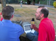 Gibson (left) and Lamar (right) atop the grave of Harvey Lillard while podcasting on SpinalColummnRadio.com episode 140.